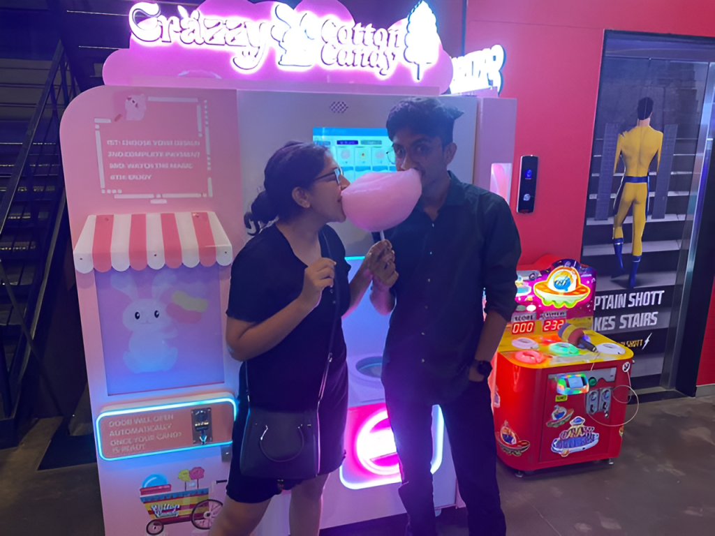 A couple eating cotton candy together