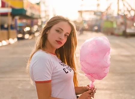 Automatic cotton candy vending machine attracting customers in shopping mall
